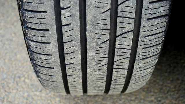 close-up of tire stacking showing proper alignment and cardboard protection layers